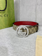 Gucci belt with GG canvas and red leather trim, round silver-toned interlocking buckle