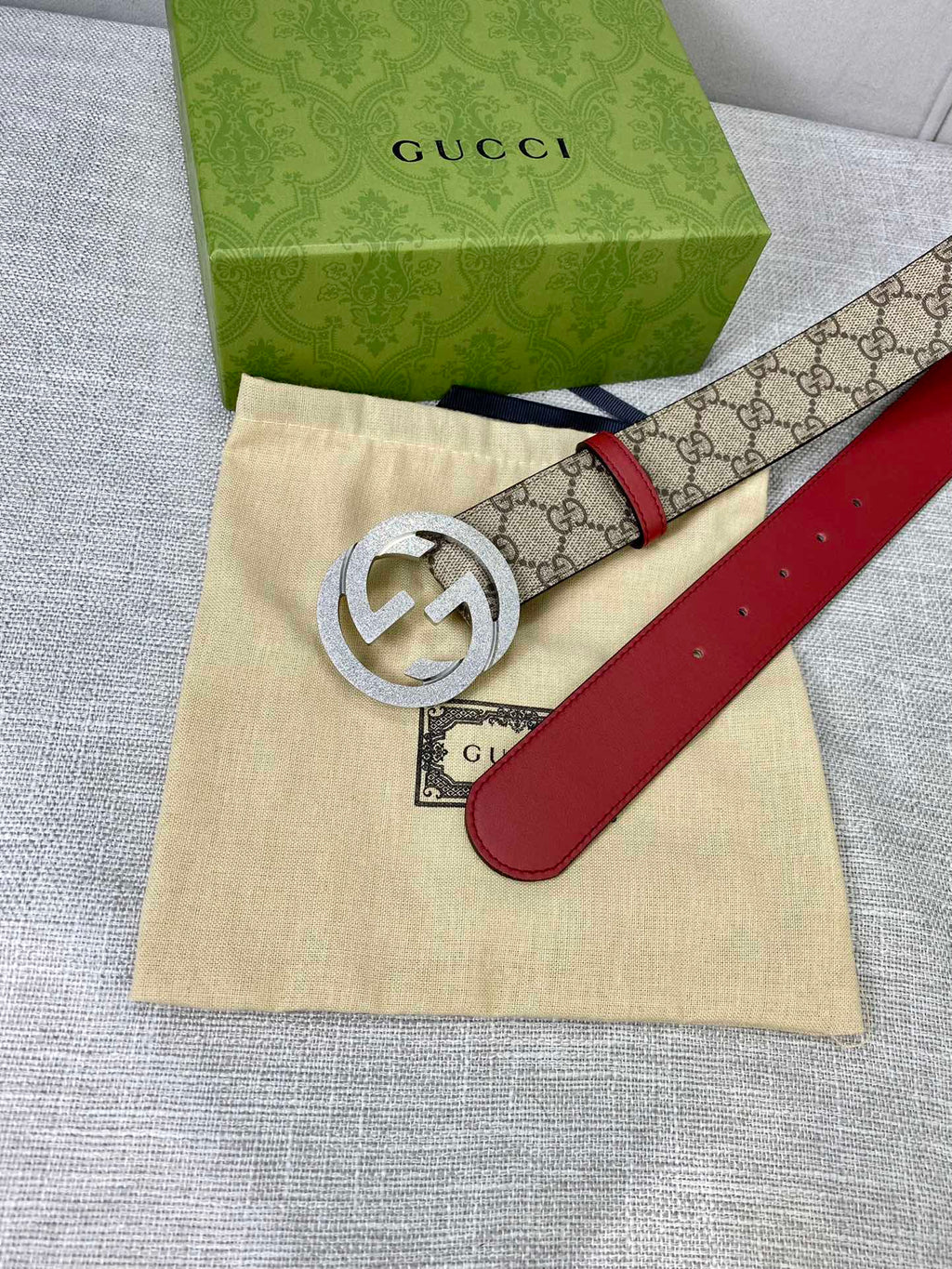 Gucci belt with GG canvas, red leather strap, silver-toned interlocking buckle and dust bag