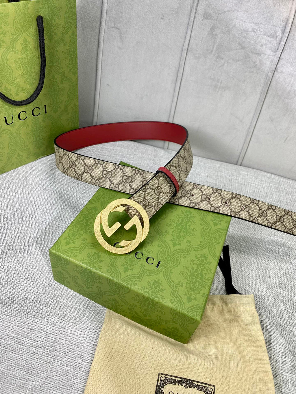 Gucci belt with GG canvas and red leather trim, gold-toned interlocking buckle