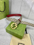 Gucci belt with GG canvas and red leather trim, gold-toned interlocking buckle
