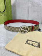 Gucci belt with GG canvas, red leather edge, round silver-toned interlocking buckle