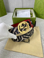 Logo-print belt with gold round buckle, red leather backing, on a beige cloth pouch.
