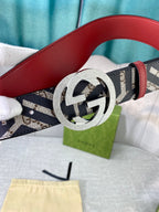 Logo-print belt with silver round buckle, red leather back strap, displayed on box.