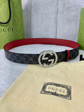 Designer belt with dark GG-print canvas and red leather edge, large silver-tone buckle.