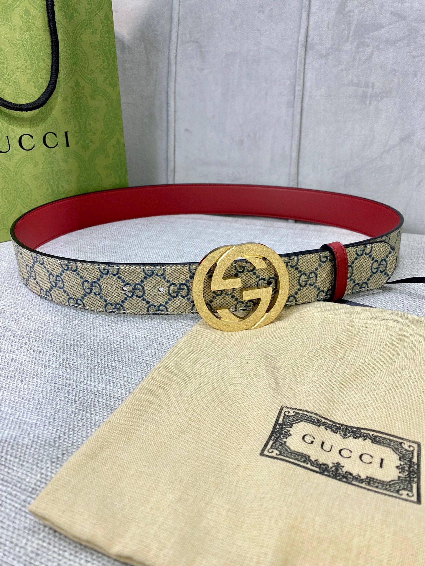 GG canvas belt with red leather trim and gold-toned interlocking buckle