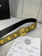Designer belt side view: black strap with gold medallion trim and gold lion buckle