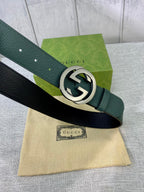 Gucci belt in dark green leather with silver-toned GG round buckle