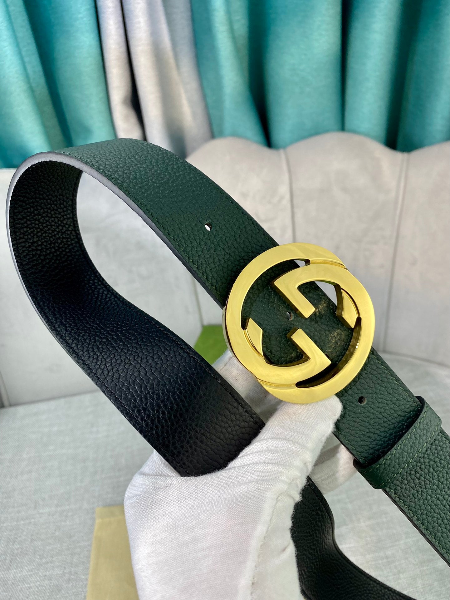 Gucci belt in dark green leather with gold-toned GG emblem buckle