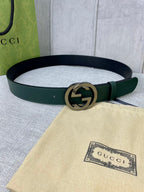 Gucci belt in dark green leather with gold-toned GG round buckle