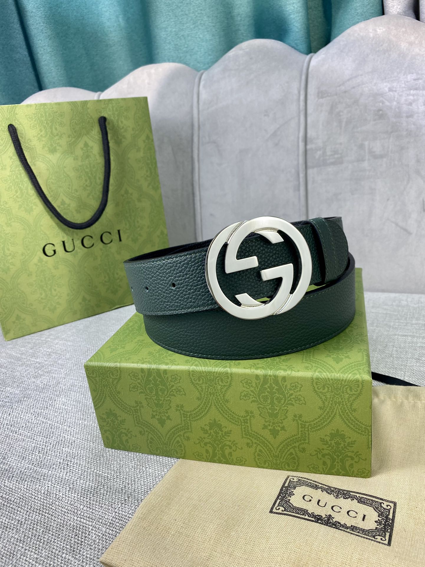 Gucci belt in dark green leather with silver-toned GG buckle ring