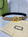 Gucci belt in beige leather with gold double-G buckle and black interior lining
