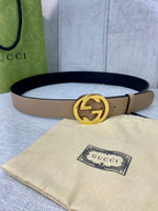 Gucci belt in beige leather with gold double-G buckle and black interior lining