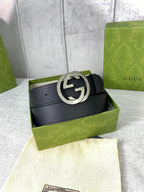 Black leather belt in gift box with silver-tone interlocking GG buckle.