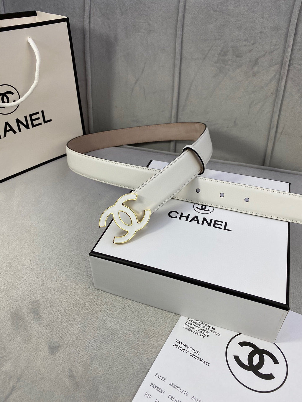 White leather belt with gold CC buckle and contrast stitching