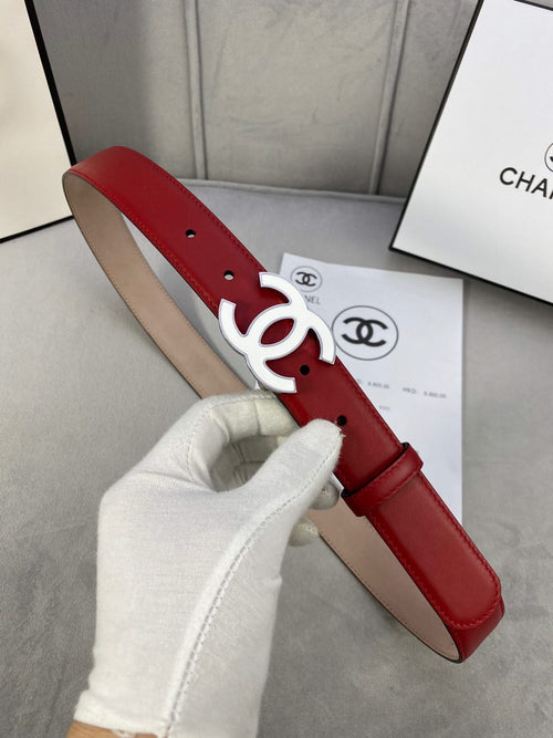 Red leather Chanel belt with silver-tone CC buckle and punched holes