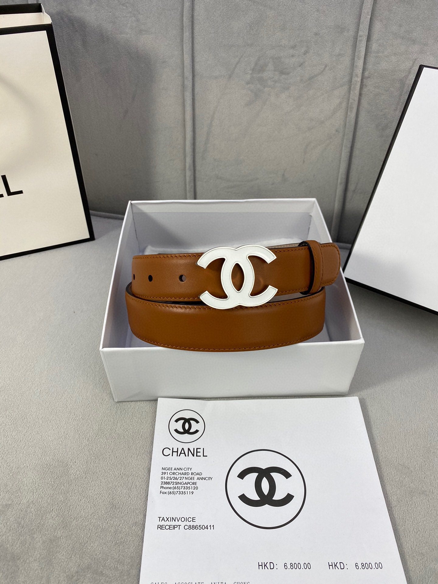 Chanel tan leather belt in a box with gold-tone CC buckle centered on strap