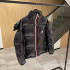 Moncler long puffer jacket front, dark with hood and red-white stripe zip