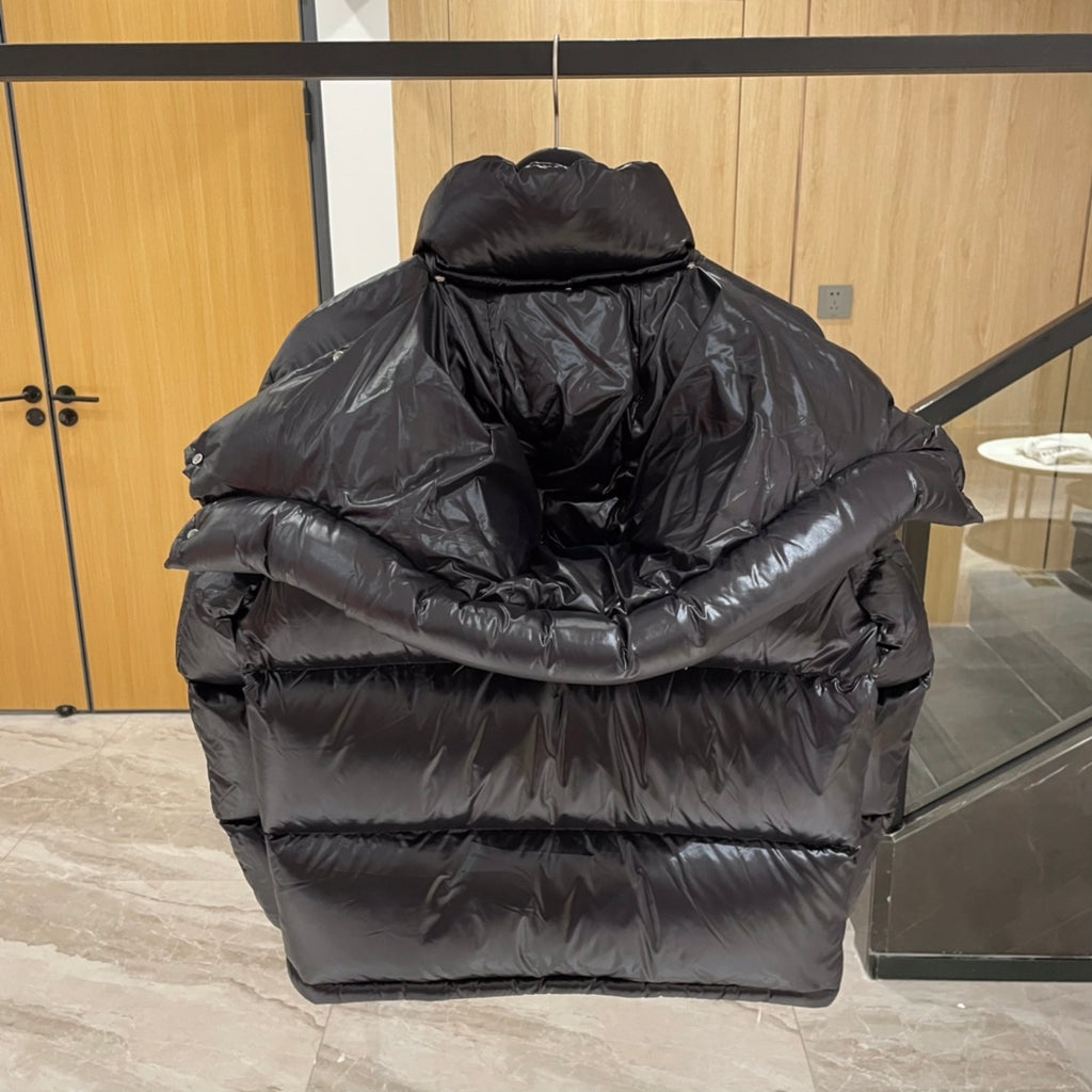 Moncler long puffer jacket back view, dark with padded hood and thick quilting