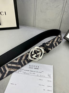Gucci belt side view: goldtone interlocking G buckle on navy/beige GG strap