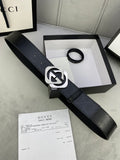 Gucci belt in dark leather with large silver interlocking buckle and pin holes.