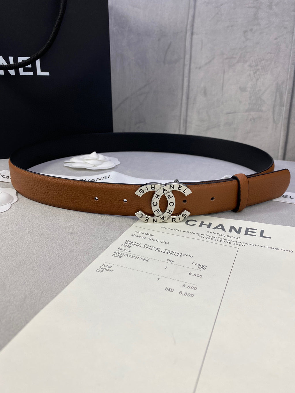 Chanel belt in tan-brown leather with gold-tone CHANEL circular buckle