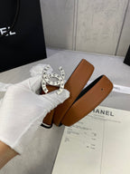 Chanel belt with tan-brown leather strap and round gold CHANEL buckle detail
