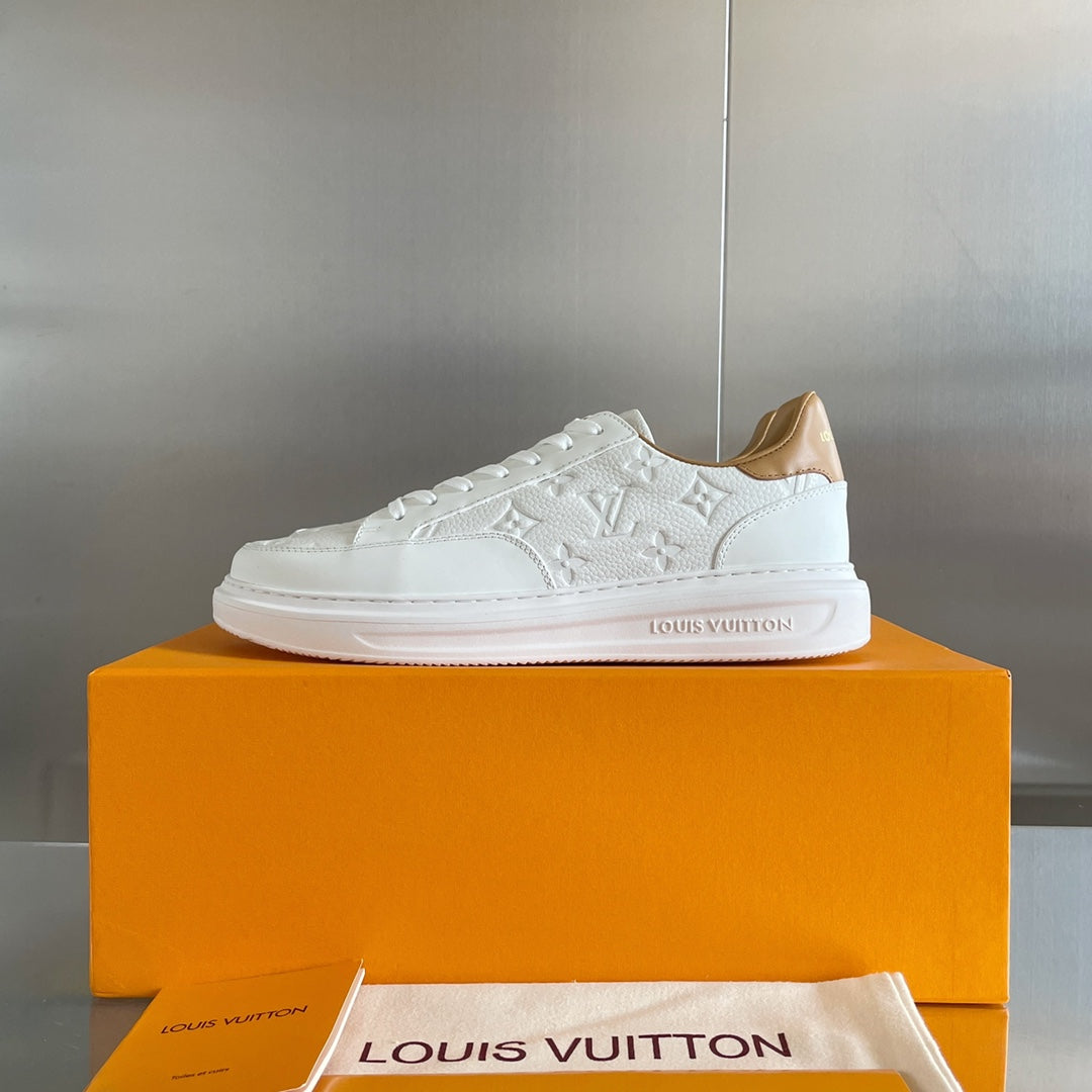 Louis Vuitton white leather sneaker on orange shoebox, low-profile sole