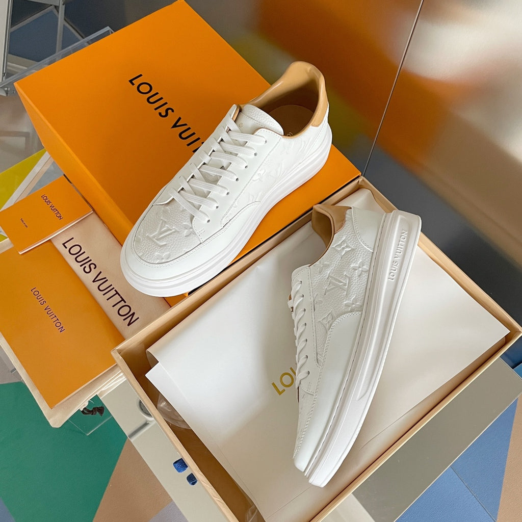 Louis Vuitton white leather sneakers with embossed monogram, lace-up front view