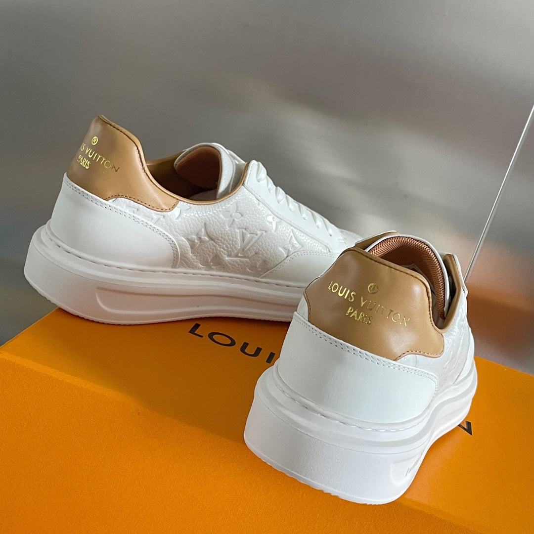 Louis Vuitton white leather sneakers, heel and side view with tan collar lining
