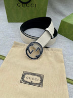 Gucci white leather belt with round black GG buckle and keeper holes