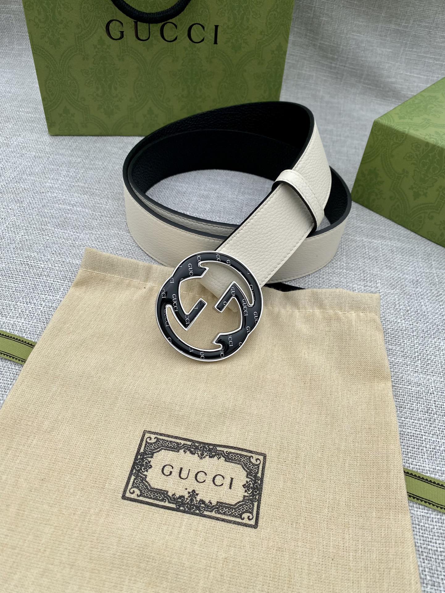 Gucci white leather belt with round black GG buckle and keeper holes