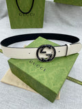 Gucci belt with white leather strap and round black GG logo buckle