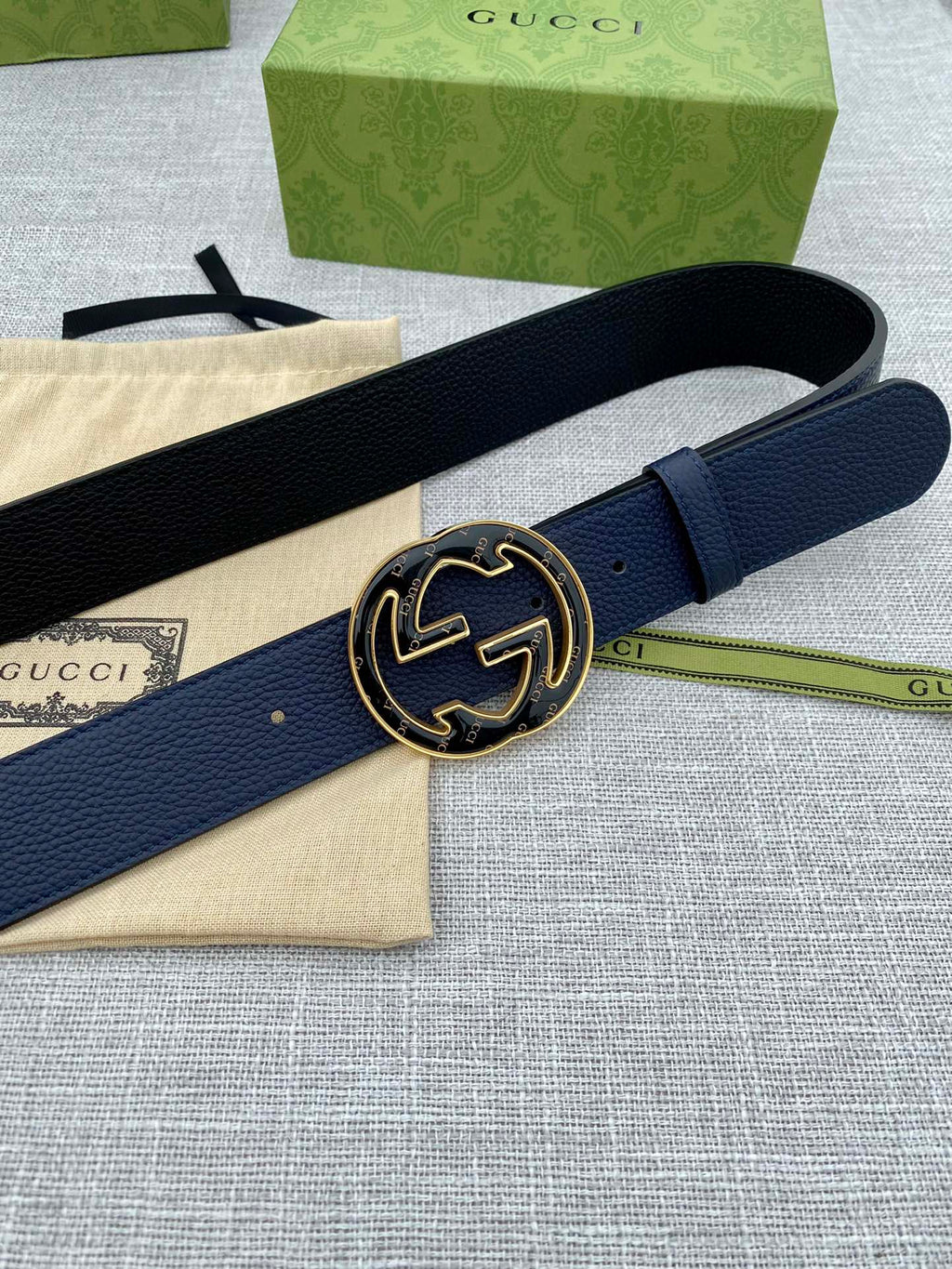 Navy blue leather belt with round double-G logo buckle, side view