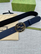 Navy blue leather belt with round double-G logo buckle, side view