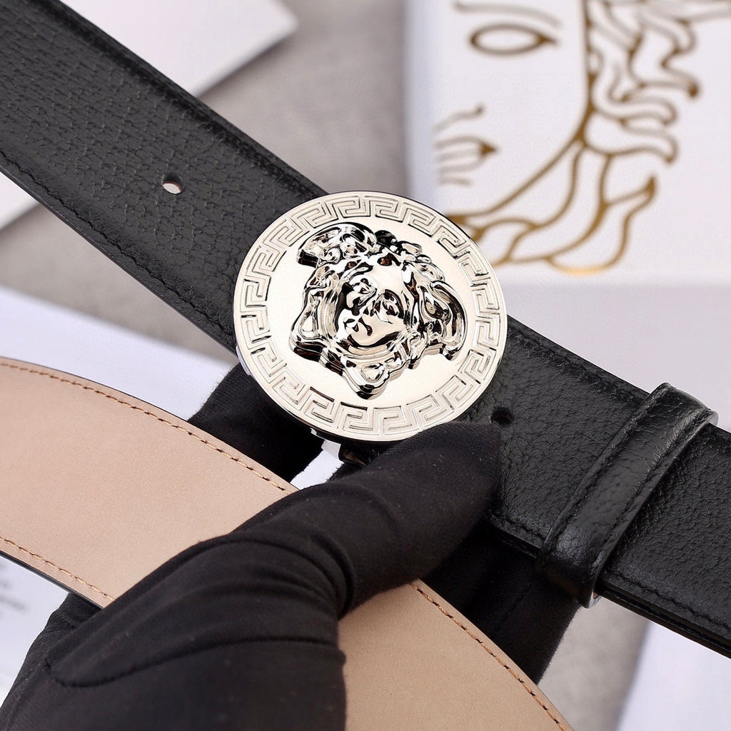 Versace belt close-up with silver-tone Medusa round buckle on black leather strap