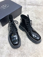 Lace-up leather boots, glossy dark leather upper, thick rubber sole, matching laces