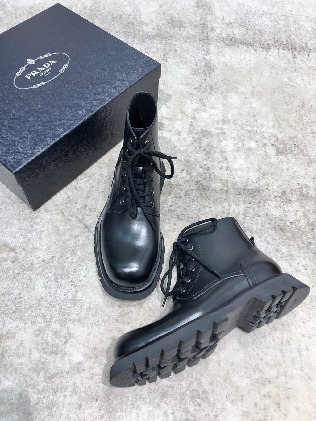 Prada unisex lace-up boots, black leather, lace-up front and chunky sole tread