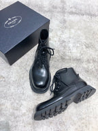 Prada unisex lace-up boots, black leather, lace-up front and chunky sole tread
