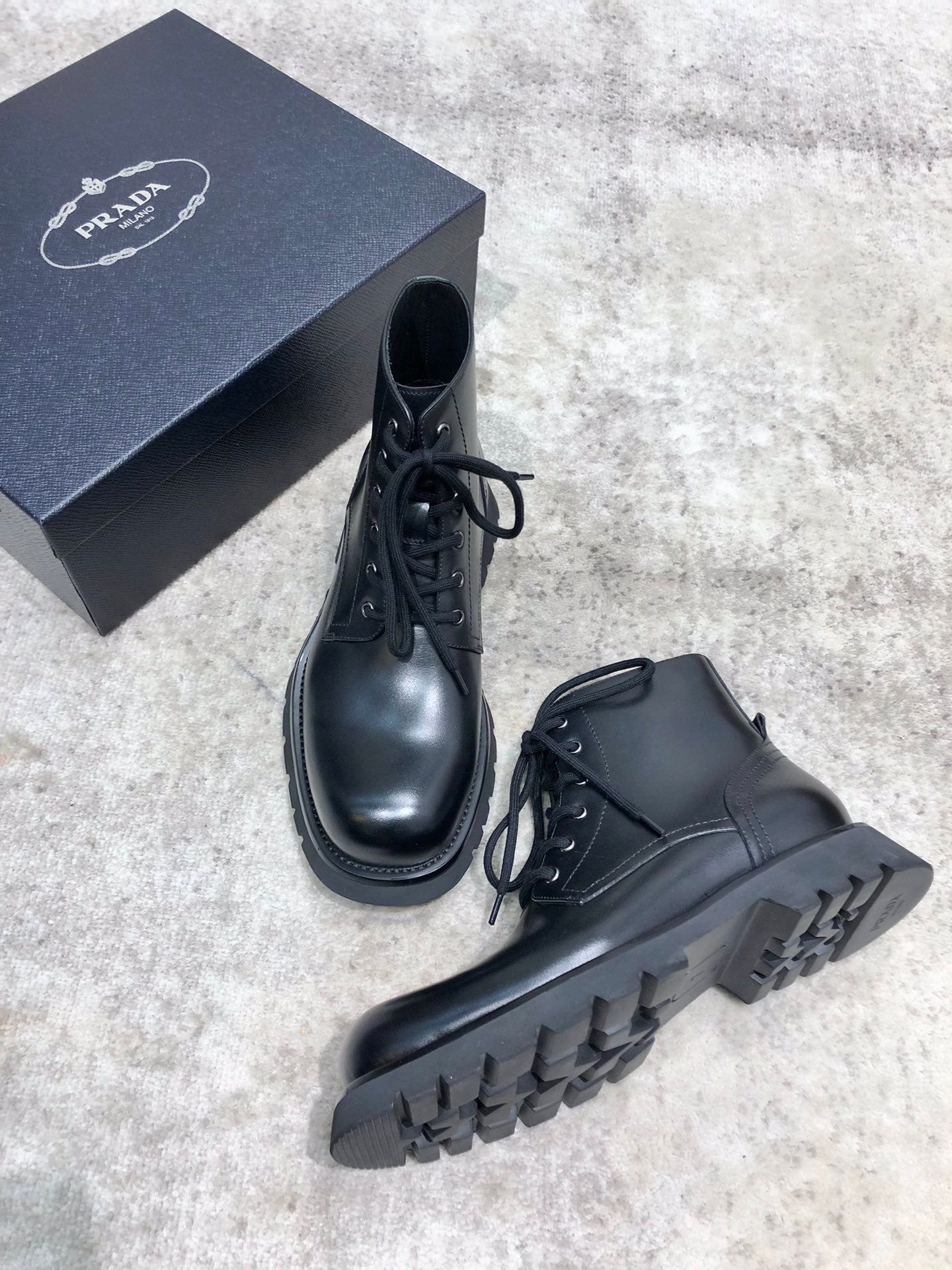Prada unisex lace-up boots, black leather, lace-up front and chunky sole tread