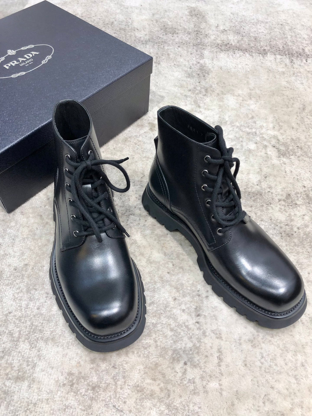 Prada unisex lace-up boots, black leather, padded collar, stitched welt and tread sole