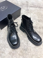 Prada unisex lace-up boots, black leather, padded collar, stitched welt and tread sole