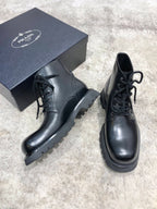 Prada unisex lace-up boots, black leather, lace-up closure and platform-style sole