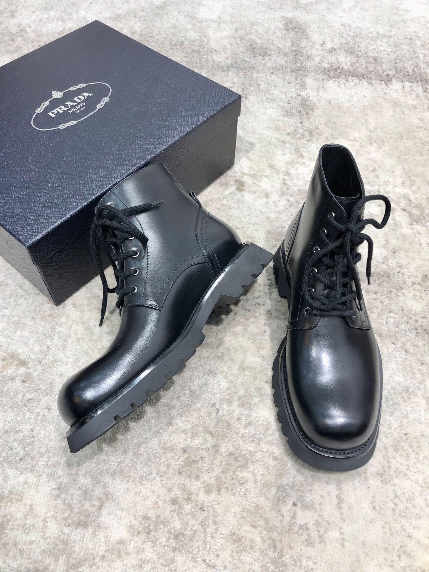 Prada unisex lace-up boots, black leather, lace-up closure and platform-style sole