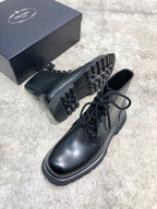 Prada unisex lace-up boots, black leather, detailed tread sole and lace-up upper