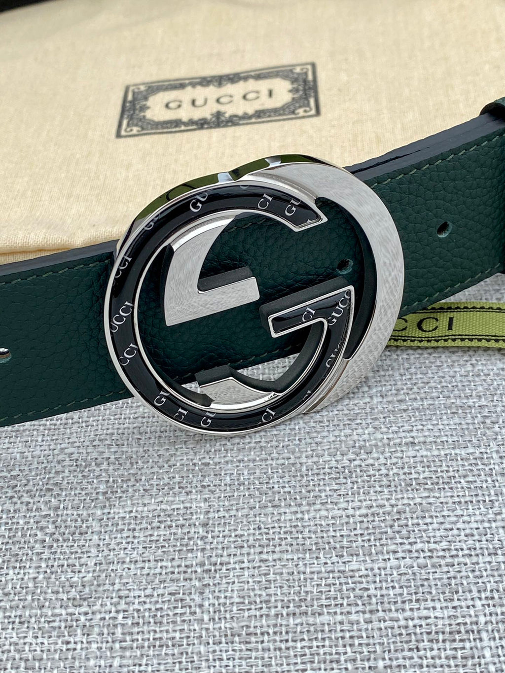 Gucci belt dark green leather with round GG buckle and silver frame