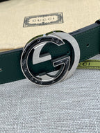 Gucci belt dark green leather with round GG buckle and silver frame