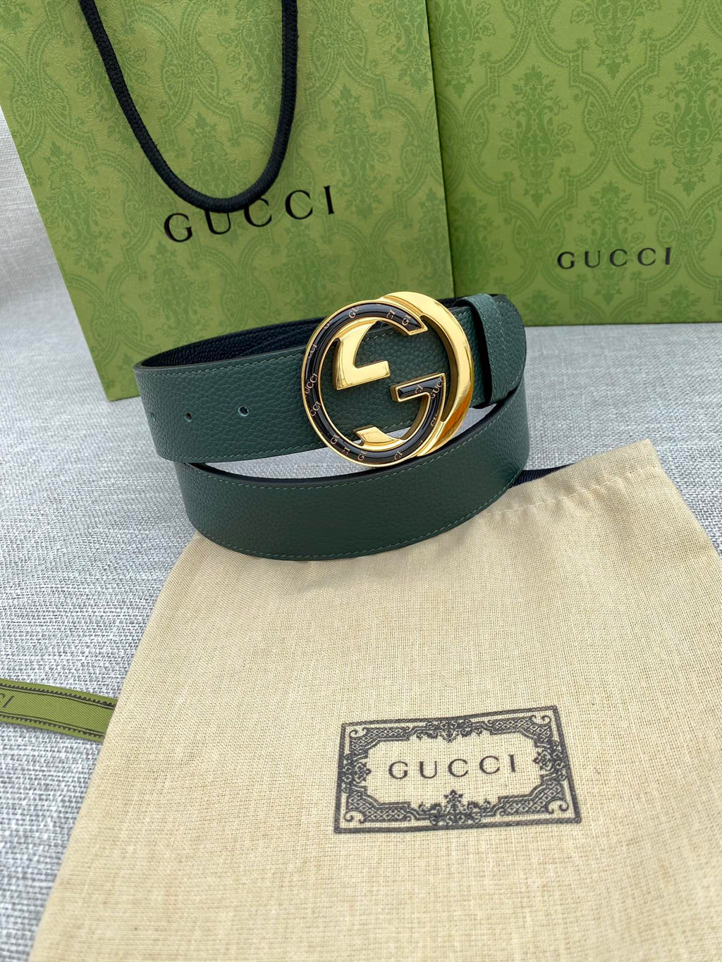 Gucci belt dark green leather with round GG logo buckle, gold-tone ring