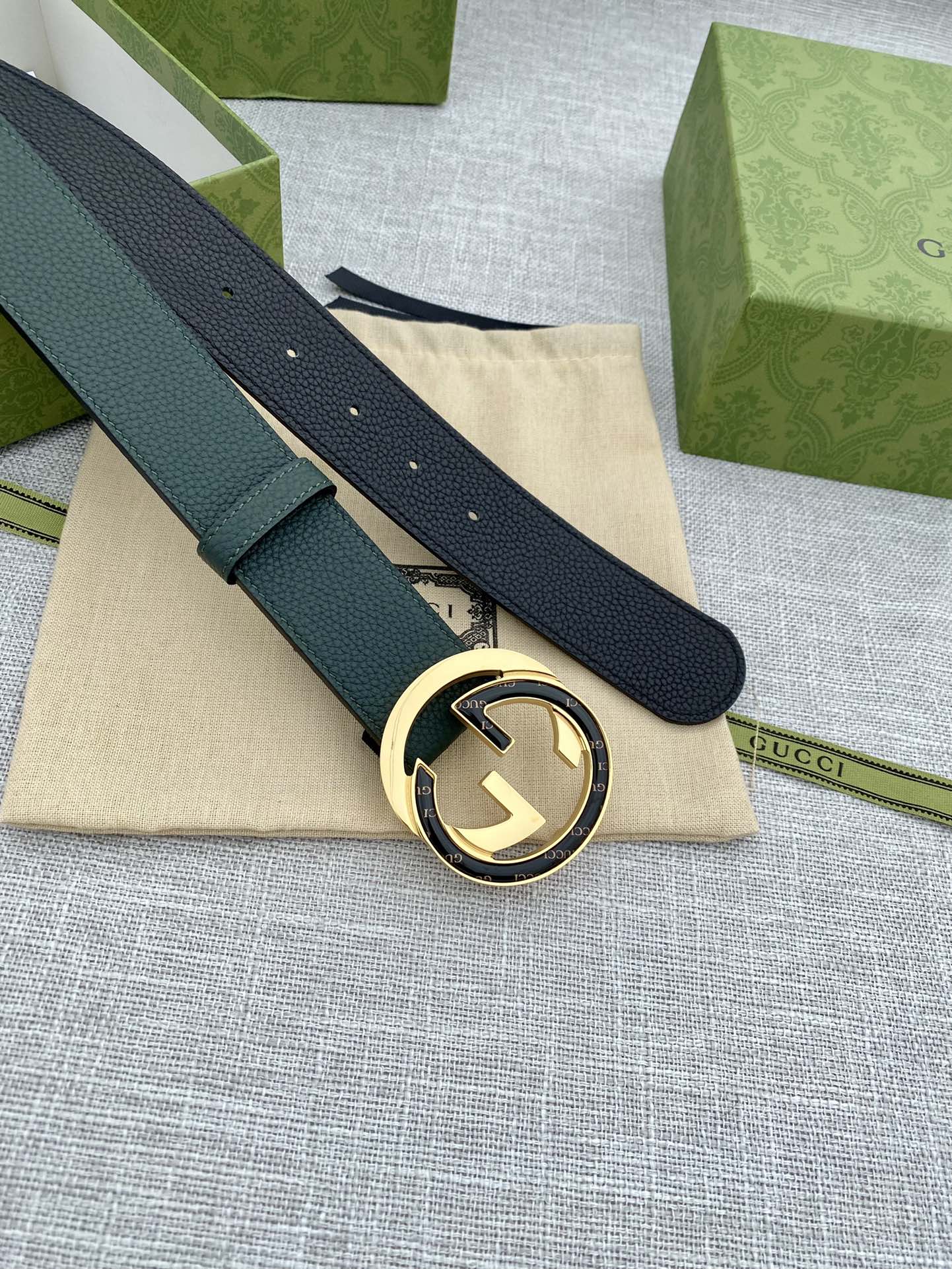 Gucci belt dark green leather with round GG buckle on folded strap