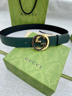 Gucci belt in dark green leather with round GG logo buckle