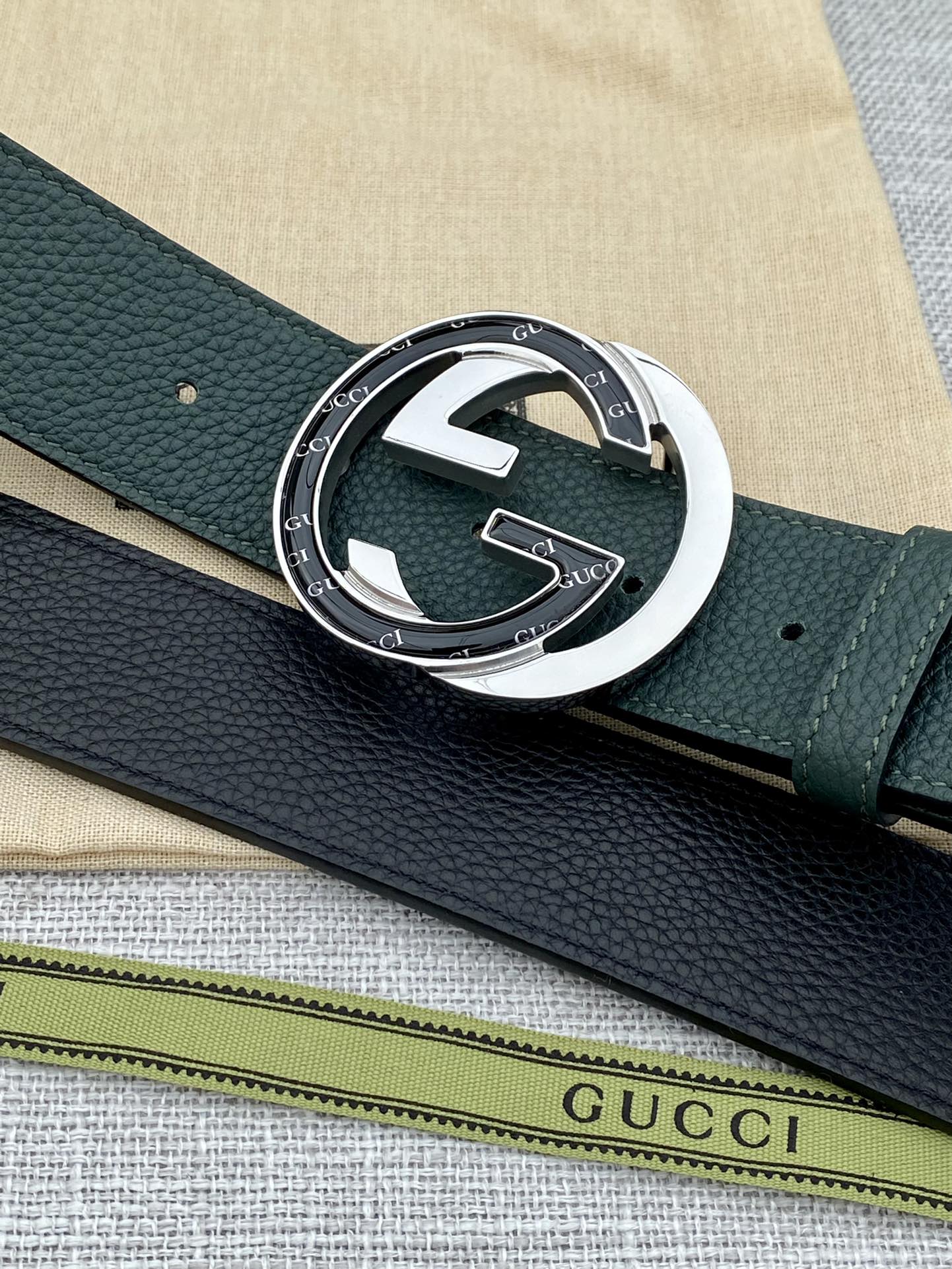Gucci belt dark green leather with round GG buckle and textured grain